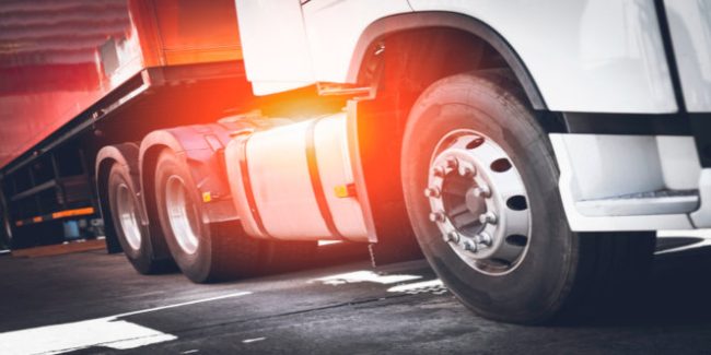 Front of Semi Trailer Truck Parking. Truck Wheels Tires. Industry Cargo Freight Trucks Transport.